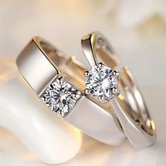 two wedding rings with diamonds on them