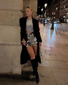 Elevate your New Year's Eve style with these 25 stunning holiday party outfit ideas. Perfect for winter gatherings or a glamorous bar night out, you'll find sparkly looks with silver sequin mini skirts, and trendy cold-weather essentials like a pair of black knee-high boots. These cute and aesthetic choices will have you turning heads wherever you go! Silver Sequin Skirt Outfit, Black And Silver Outfits, Sequin Skirt Outfit, Eve Fashion, Silver Sequin Skirt, Cool Looks, Ny Outfits, Modest Casual Outfits