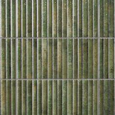 an image of a grate with grass growing on it