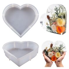 two heart shaped trays with flowers in the middle and one holding a flower arrangement