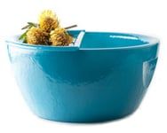 a blue bowl with yellow flowers in it