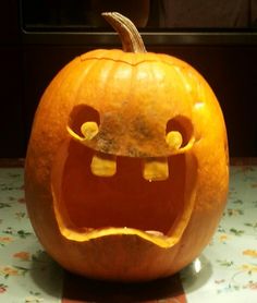 a carved pumpkin with an angry face on it