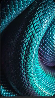 an image of a snake skin pattern that is blue and green with purple highlights on it