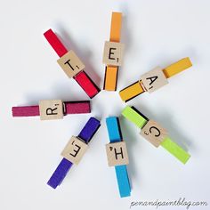 the word teach spelled out with wooden blocks and letters arranged in a circle on top of each other