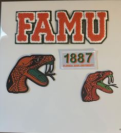 some stickers on the back of a refrigerator door that says, famu 1897