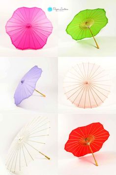 four different colored umbrellas with wooden sticks sticking out of the top one and bottom one