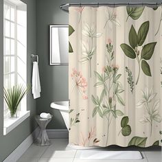 a bathroom that has a shower curtain with flowers on it