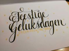 a close up of a piece of paper with the words festive gluksdagen written on it