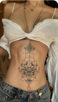 a woman with a tattoo on her stomach