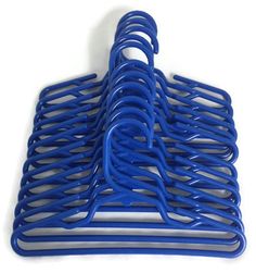 several blue plastic chairs stacked on top of each other