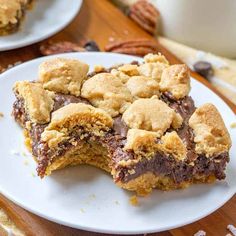 a white plate topped with chocolate chip cookie bars