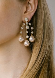 A mix of round and baroque-style pearls cascade gently from the luminous Dara Earrings. These regal chandelier earrings add some elegance to your look this holiday party season. We love pulling back our hair to really let these earrings shine. Discover more all new earrings. Dimensions: 2.75 inch length Round Pearl Earrings, Pearl Bride, Luxury Hair Accessories, Jennifer Behr, Hoop Earring Sets, Gold Chandelier, Luxury Hair, Baroque Fashion, Bridal Fashion