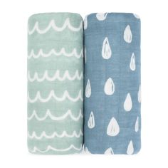 two blue and green towels with white drops on them