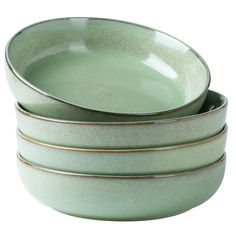 three green bowls stacked on top of each other