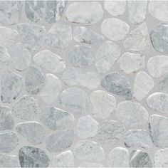 white and grey rocks are arranged on a gray background