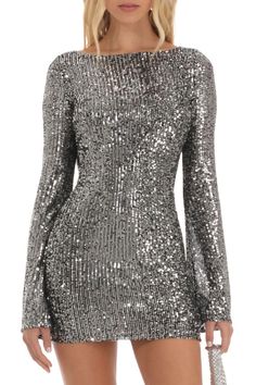 Description: Light up the night in our sparkly sequin dresses, perfect for any upcoming bash. Flaunt a bit of cheeky charm with the draped open back detail, and dance the night away with flared cuffs adding a dash of drama. This shimmering bodycon mini dress, bedazzled with eye-catching sequin embellishments, comes in sleek gray or crisp white. It's a must-have for your wardrobe from our boutique - ideal for women who love to stand out. 'Turn heads, steal hearts – Make every entrance unforgettab Fall Party Dress, Backless Cocktail Dress, Strapless Dresses, Mini Bodycon Dress, Fall Party, Dress Spring, 2023 Fashion, Silver Dress, Style Streetwear