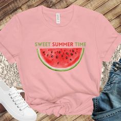 "Sweet summertime is a reason to celebrate! A cute watermelon print along with \"sweet summer time\" printed on the chest.  This classic unisex jersey short sleeve tee fits like a well-loved favorite. Soft cotton and quality print available in 4 colors!" Sweet Pink Summer Tops, Sweet Pink Summer Top, Sweet Fruit Print Summer Tops, Sweet Summer Tops With Fruit Print, Pink Fruit Print Tops For Summer, Sweet Fruit Print Tops For Summer, Sweet Cotton Summer Top, Pink Fruit Print T-shirt For Summer, Summer Fruit Design Crew Neck T-shirt