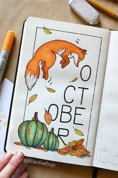 an open notebook with the words october written on it and a drawing of a fox