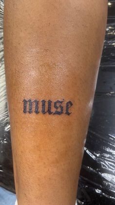 a person with a tattoo on their leg that says nurse written in black ink next to the word nurse