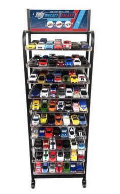 a display case filled with lots of toy cars on top of each other in front of a white background