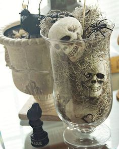 there is a vase with fake skulls in it