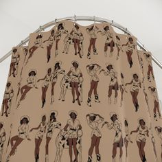 the curtain is decorated with an image of people in different poses and sizes on it