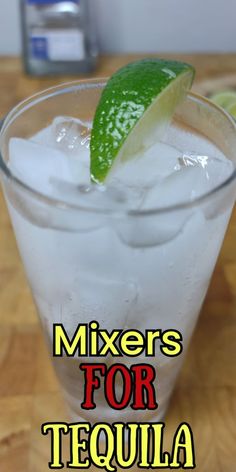 a close up of a drink on a table with the words mixers for tequila