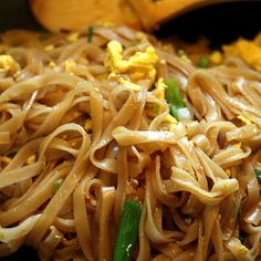 noodles and vegetables are mixed together in a bowl