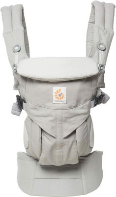 a white baby carrier with grey straps