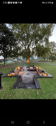 a fire pit in the middle of a field