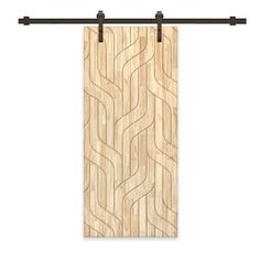 a wooden door with black metal handles and an abstract pattern on the front, hanging from a