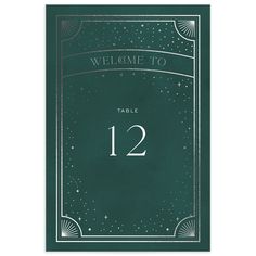 a green table number card with the numbers twelve and twelve on it, in an art deco