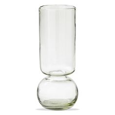 a clear glass vase sitting on top of a white table