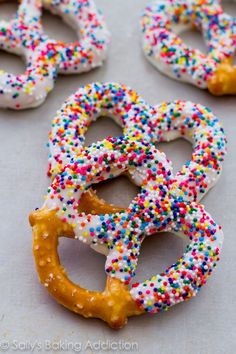 several pretzels with sprinkles and white frosting