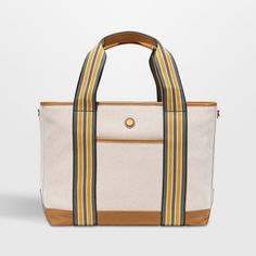 Hit the road, take to the skies or head to the beach with the handsome Cabana tote from Paravel. Crafted of creamy, textured canvas with a stain-repellant coating, the durable bag is accented with tan vegan leather details and straps striped jauntily in olive, mustard and white. Carry the tote to the office or pool, use as your personal item on flights or pack for overnight trips. The water-resistant blue satin lining finishes the medium bag with a secret touch of luxury.   • Durable, stain-repe Secret Touch, Shandy, Medium Bag, Textured Canvas, Stripes Texture, Hit The Road, Luggage Accessories, Canvas Texture, Blue Satin