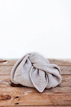 a white bag sitting on top of a wooden floor