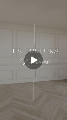 an empty room with wood floors and white walls, the words les frreurs on it