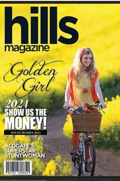 a magazine cover with a woman riding a bike on the front and yellow flowers in the background