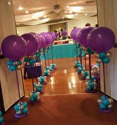 balloons and streamers are on the floor in front of an entrance to a party