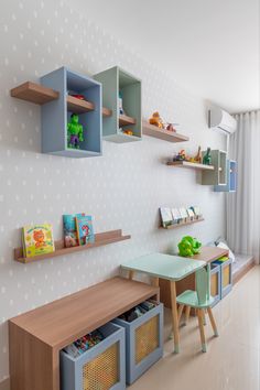 a child's playroom with toys and bookshelves on the wall,