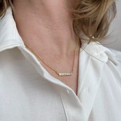 Elevate your elegance with our 18k Gold Filled CZ Bar Necklace. This sophisticated piece features a sleek, horizontal bar encrusted with sparkling cubic zirconia, offering a perfect blend of modern simplicity and timeless charm. Available in stunning color options of crystal, black and emerald, this necklace adds a personalized touch to your style. The 18k gold fill ensures lasting shine and durability, making it an ideal accessory for both everyday wear and special occasions. Add a touch of ref Hand Chain Bracelet, 18k Gold Chain, Cubic Zirconia Necklace, Zodiac Necklaces, Hand Chain, Emerald Jewelry, Anklet Jewelry, Cuff Bangles, Earrings Collection