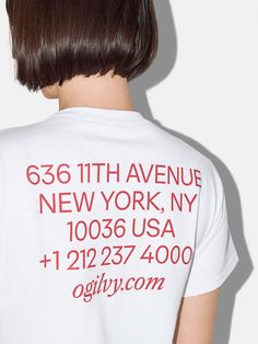 the back of a woman's white shirt with red writing on it that says, 68th avenue new york, ny