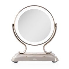 a round mirror sitting on top of a metal stand in front of a white background