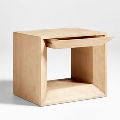 a small wooden table with one drawer open