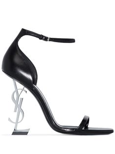 Black leather Opyum 100mm leather sandals from SAINT LAURENT featuring branded insole, open toe, buckle-fastening ankle strap and signature YSL initials heel. | Saint Laurent Opyum 100mm leather sandals Black And Silver Heels, Ysl Heels, Ysl Shoes, Girly Shoes, Black Leather Sandals, Saint Laurent Shoes, Silver Heels, Pretty Shoes, Dream Shoes