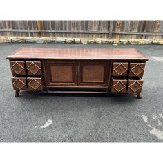 an old wooden dresser with many drawers