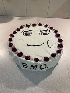 a cake that has been decorated with an emo face