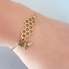 "This listing is for one Bee bangle. Made with high quality gold or silver plated over brass metal. Unique handmade bangles will make a great gift for someone special , or just add it to your stylish jewelry collection. It comes in silver or gold finish and three different sizes. Please make your selection at checkout. Small: 2.5 inches in Diameter (or 8 inch circumference) \"POPULAR\" Medium: 2.75 inches in diameter (or 8.5 inch circumference) Large: 3 inches in diameter (or 9 inch circumferenc Honey Bee Accessories, Bee Themed Jewelry, Honey Bee Bracelet, Bumble Bee Outfit, Bee Accessories, Bee Outfit, Bee Fashion, Gold Bracelet Bangle, Palm Bracelet