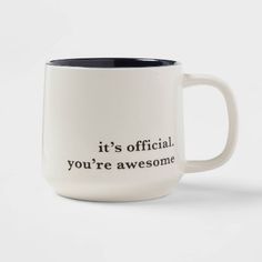 a white and black coffee mug with the words it's official you're awesome