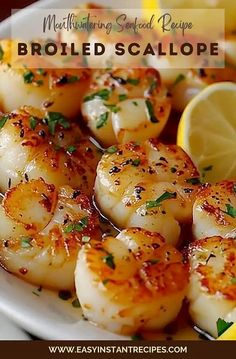 shrimp scallops on a plate with lemon wedges and parsley